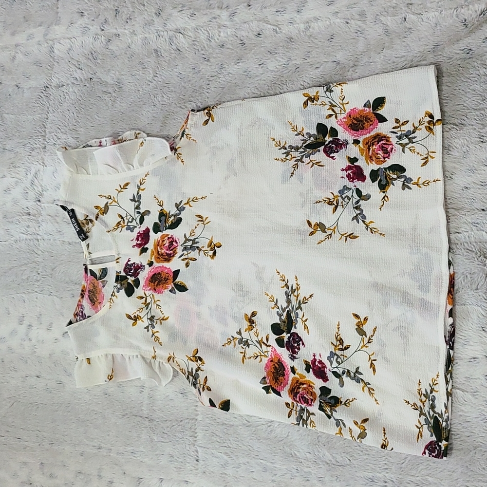 sleeveless floral blouse